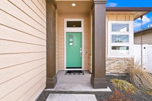 a front door of a house with a green door at Guest Favorite 3BD 2BA Meridian Home for Business & Pleasure in Meridian