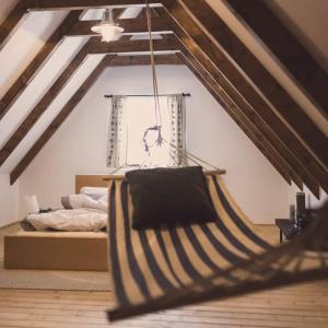 a bedroom with a bed in a attic at chalupa Maletínka in Starý Maletín