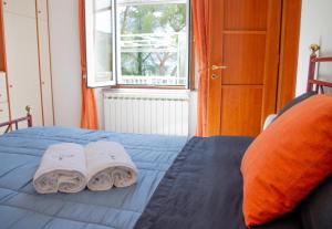 Säng eller sängar i ett rum på La Spezia 5 terre appartamento - Deluxe