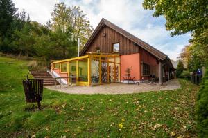 a small house with a large patio in front of it at Landhaus Seiffen in Seiffen