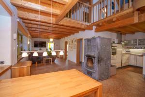 a large living room with a fireplace in a house at Landhaus Seiffen in Seiffen