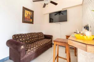 a living room with a couch and a table at Shaw Park Gem Apt 12A in Ocho Rios