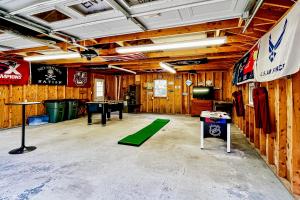 a room with wooden walls and a ping pong table at EZ Sunday Morning in Bethel