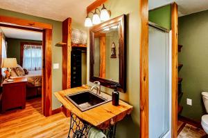a bathroom with a sink and a mirror at EZ Sunday Morning in Bethel +54 photos