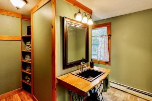 a bathroom with a sink and a mirror at EZ Sunday Morning in Bethel +23 photos