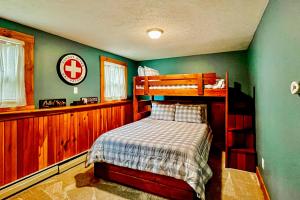 a bedroom with a bunk bed in a house at EZ Sunday Morning in Bethel