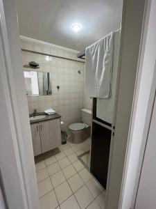 a small bathroom with a toilet and a sink at Apartamento próximo ao metro Jabaquara, apto 47 in São Paulo