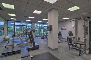 a gym with treadmills and machines in a room at Beachfront Marco Island Condo with Pool Access! in Marco Island