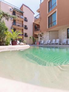 an empty swimming pool in an apartment building at Villa Brigantina in Sunny Beach