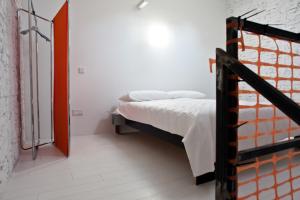 Postel nebo postele na pokoji v ubytování Legrenzi Rooms
