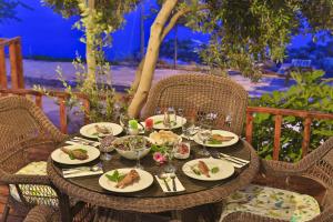 a table with plates of food on it at Hamarat Otel in Kaş