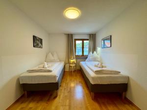 a room with two beds in a room at Bauernchalet Alois in Dornbirn