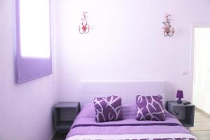 Uma cama ou camas num quarto em Alojamento Local S. Bartolomeu