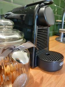 a jar of food sitting next to a toaster at Bükki csend vendégház in Bükkszentkereszt