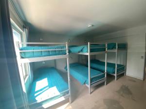 Postel nebo postele na pokoji v ubytování Hostel Cienfuegos