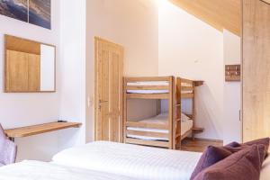 Postel nebo postele na pokoji v ubytování Chalet Fanningberg