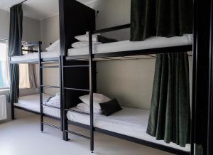 a group of bunk beds in a room at RING Sport Hostel in Tallinn