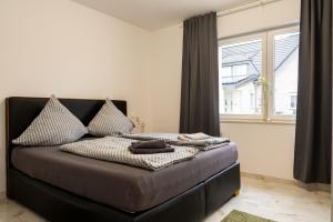 מיטה או מיטות בחדר ב-Wohnung in Haddenhausen