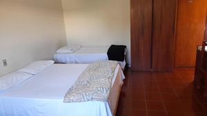 Postel nebo postele na pokoji v ubytování Hotel Itália