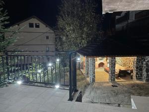 a view of a patio at night with lights at Pensiunea Joe Paltinis in Păltiniş