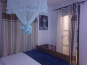 Postel nebo postele na pokoji v ubytování Rosa Negra Uganda
