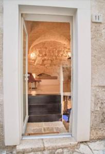 a window in a building with a staircase in it at Amarcord private Spa Ostuni in Ostuni