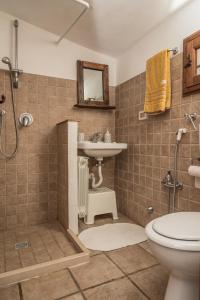 a bathroom with a shower and a sink and a toilet at B&b Cinque Stalle in Monopoli