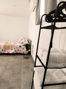 a bedroom with a bunk bed and a tiled floor at El susurro del tajo. El rio in Toledo