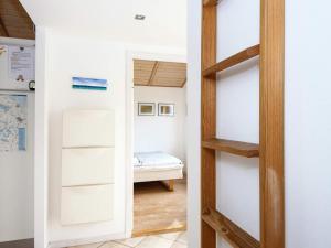 a room with a door leading to a bedroom at Three-Bedroom Holiday home in Ulfborg 5 in Thorsminde