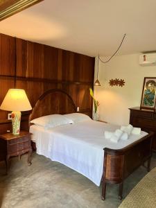 Katil atau katil-katil dalam bilik di Boa Village- Bungalow com Piscina Natural- Praia de Algodões
