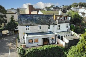 an aerial view of a white house at The Old Cottage Bakery in Lyme Regis