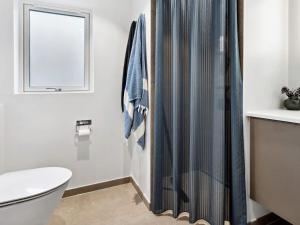 a bathroom with a toilet and a shower at Luxury Villa with Pool - By Traum Ferienwohnungen in Kongsmark +30 photos