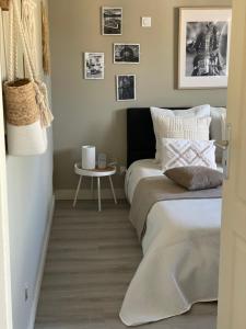 a bedroom with two beds and a small table at Chez Flo in Avignon