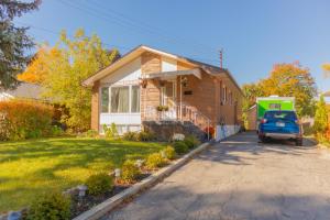 a house with a car parked outside of it at Cozy Private Room-Your Perfect place in Hamilton in Hamilton