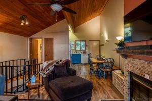 a living room with a couch and a fireplace at Escape To Ptarmigan Village 86 in Whitefish