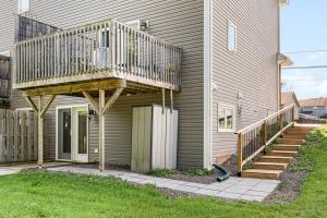 a deck on the side of a house at Quite 1 bedroom apartment. in Dieppe