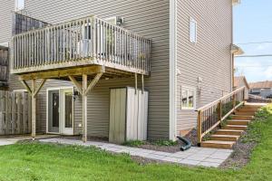a deck on the side of a house at Quite 1 bedroom apartment. in Dieppe