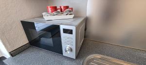 a microwave oven sitting on top of a wall at City Wohnung 3 Zimmer in Bremen