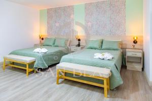 Postel nebo postele na pokoji v ubytování Hotel San Blas