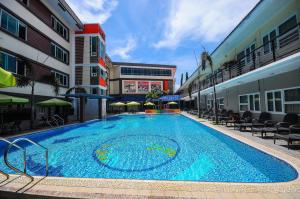 a large swimming pool in the middle of a building at Interpark Hotel in Olongapo