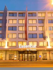 a large building with a sign that reads external by donut at Essential by Dorint Basel City in Basel