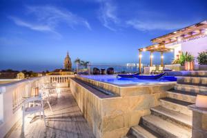 a resort with a swimming pool on top of a building at NH Royal Urban Cartagena in Cartagena de Indias