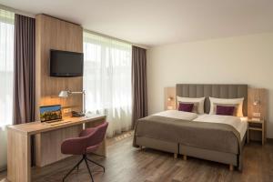 Essential by Dorint Basel City客房内的一张或多张床位