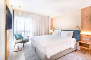 Voodi või voodid majutusasutuse Radisson Hotel Saint Denis, La Reunion toas