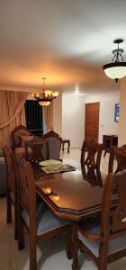 a dining room with a table and chairs at You deserve a comfortable stay! in Santiago de los Caballeros