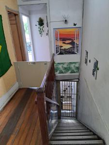 a staircase in a house with a stair case at Botafogo Guesthouse in Rio de Janeiro