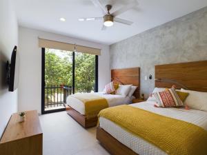 Postelja oz. postelje v sobi nastanitve Spacious and centrally apartment a few streets from the beach By Yeah + 27 fotografij