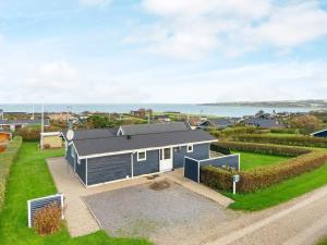 a tiny house with a view of the ocean at Three-Bedroom Holiday home in Lemvig 6 in Lemvig