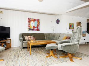 a living room with a couch and a coffee table at Three-Bedroom Holiday home in Lemvig 6 in Lemvig