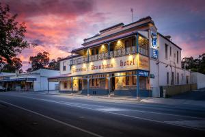 a building on the side of a street at night at Barossa Brauhaus Hotel in Angaston